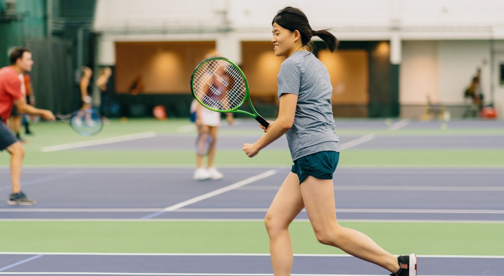 people playing tennis on tennis courts