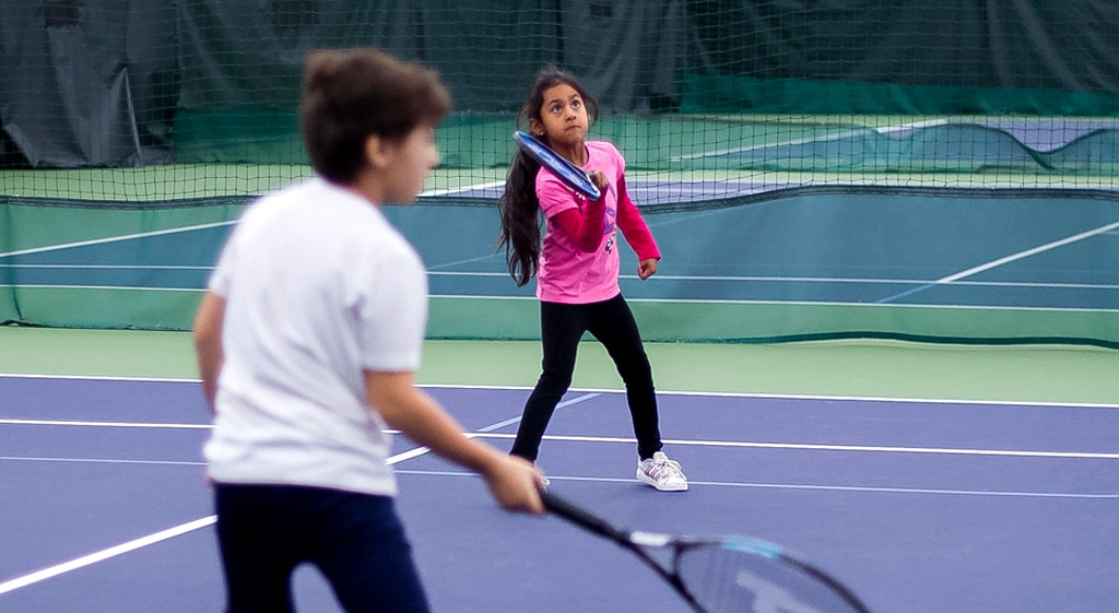 Kids playing tennis