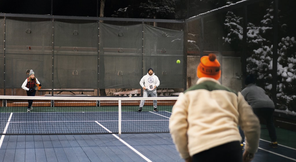 Playing a doubles tennis match