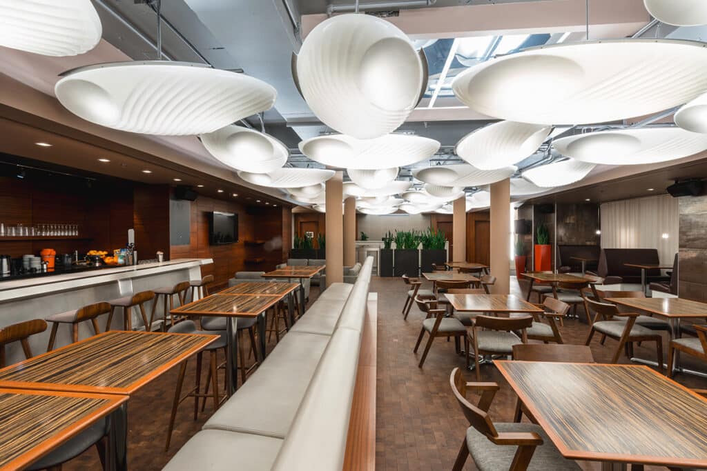 Tables and chairs in cafe at Midtown Athletic Club Montreal