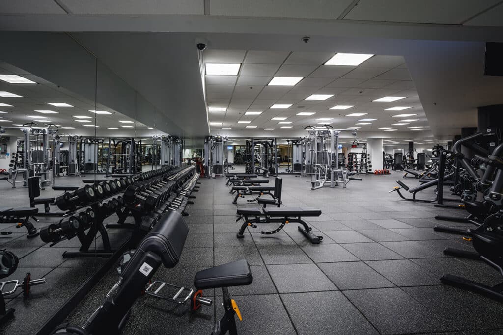 Fitness floor featuring weights at Midtown Athletic Club Montreal