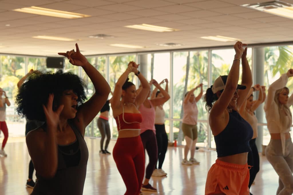 Members dance during Zumba fitness class at Midtown Athletic Club Weston