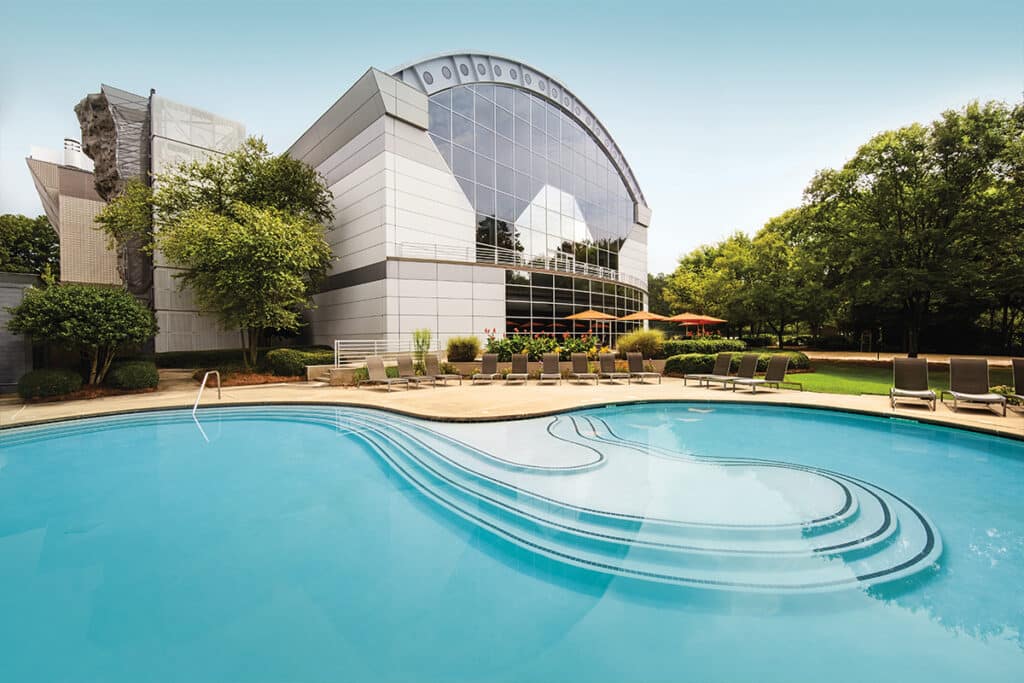 Outdoor pool and building at Windy Hill Athletic Club