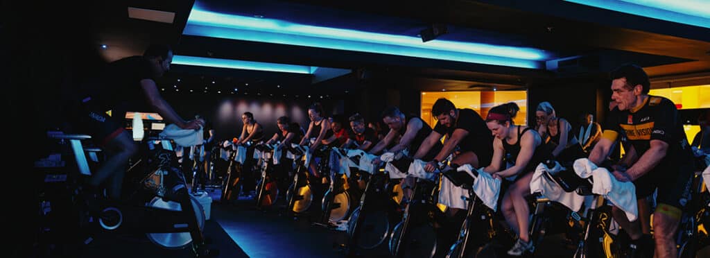 Members participate in group spinning class.