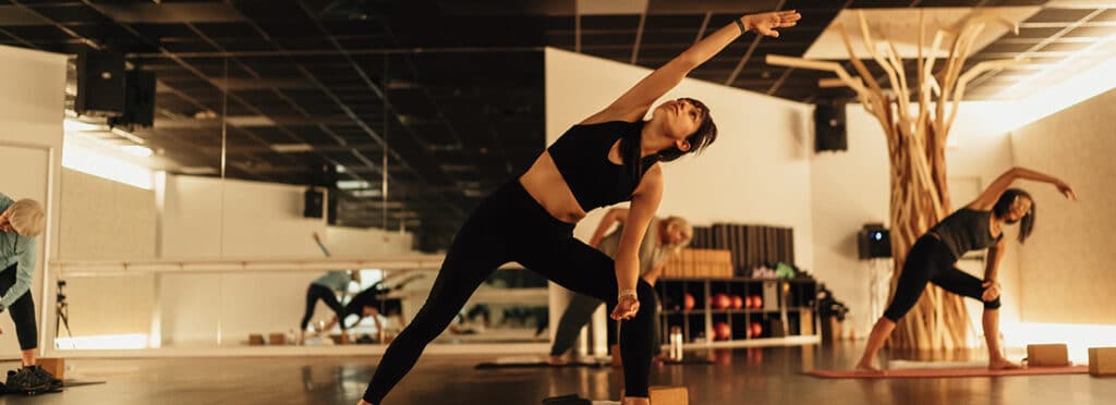 Midtown members participate in yoga class.