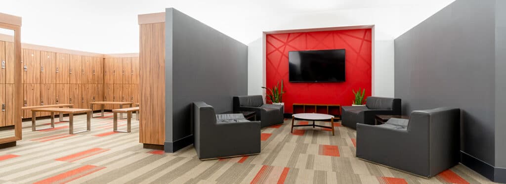 Sitting area and lockers in locker room at Windy Hill Athletic Club.