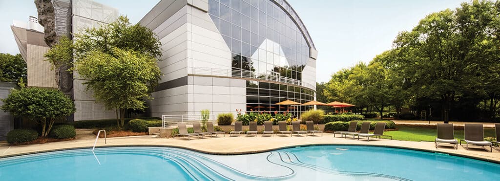 Outdoor pool and building at Windy Hill Athletic Club.