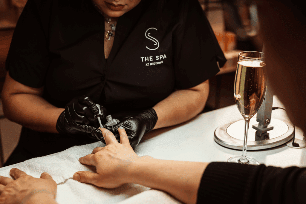 Detail of Midtown Chicago’s spa manicure service with professional nail care, signature spa branding, and elevated guest amenities.