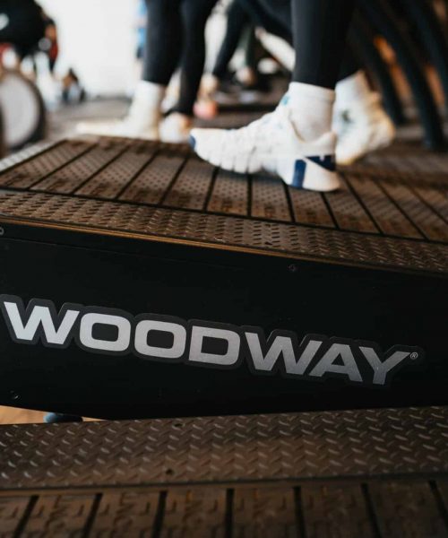 woodway newsletter View of shoes walking on an inclined Woodway treadmill.